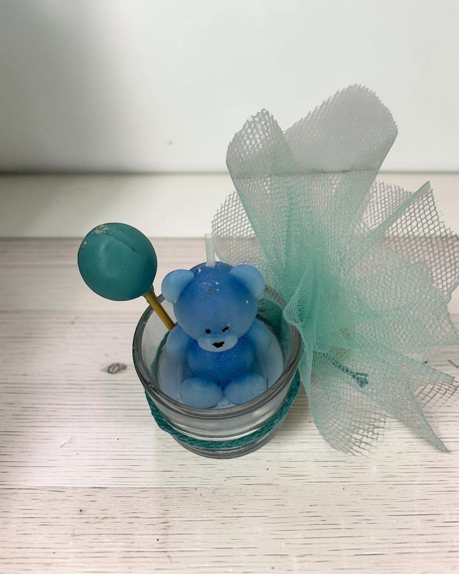 ELAIOPHOS blue teddy bear candle with balloon accent in glass jar, perfect for baby showers and birthdays.