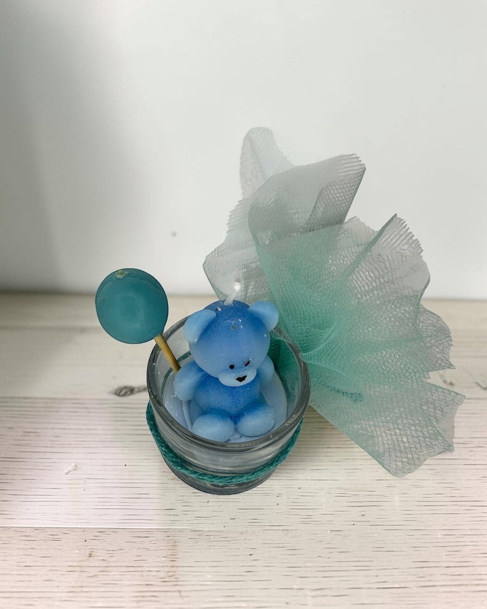 ELAIOPHOS blue teddy bear candle with balloon accent in glass jar, perfect for baby showers and birthdays.
